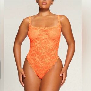 CLOSET CLEAR OUT NWT SKIMS Neon Orange Stretch Lace Intimates Thong Bodysuit